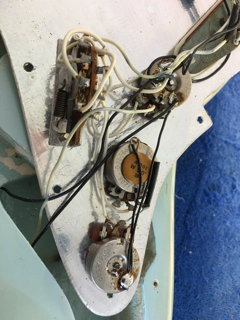vintage 1972 Fender Stratocaster adorned with wires, highlighting its refinished look. SOLD.