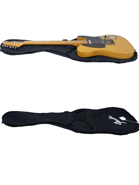 yellow Fender Squier JV Telecaster – 52 Reissue from Japan, 1984, rests inside a sleek black guitar case.